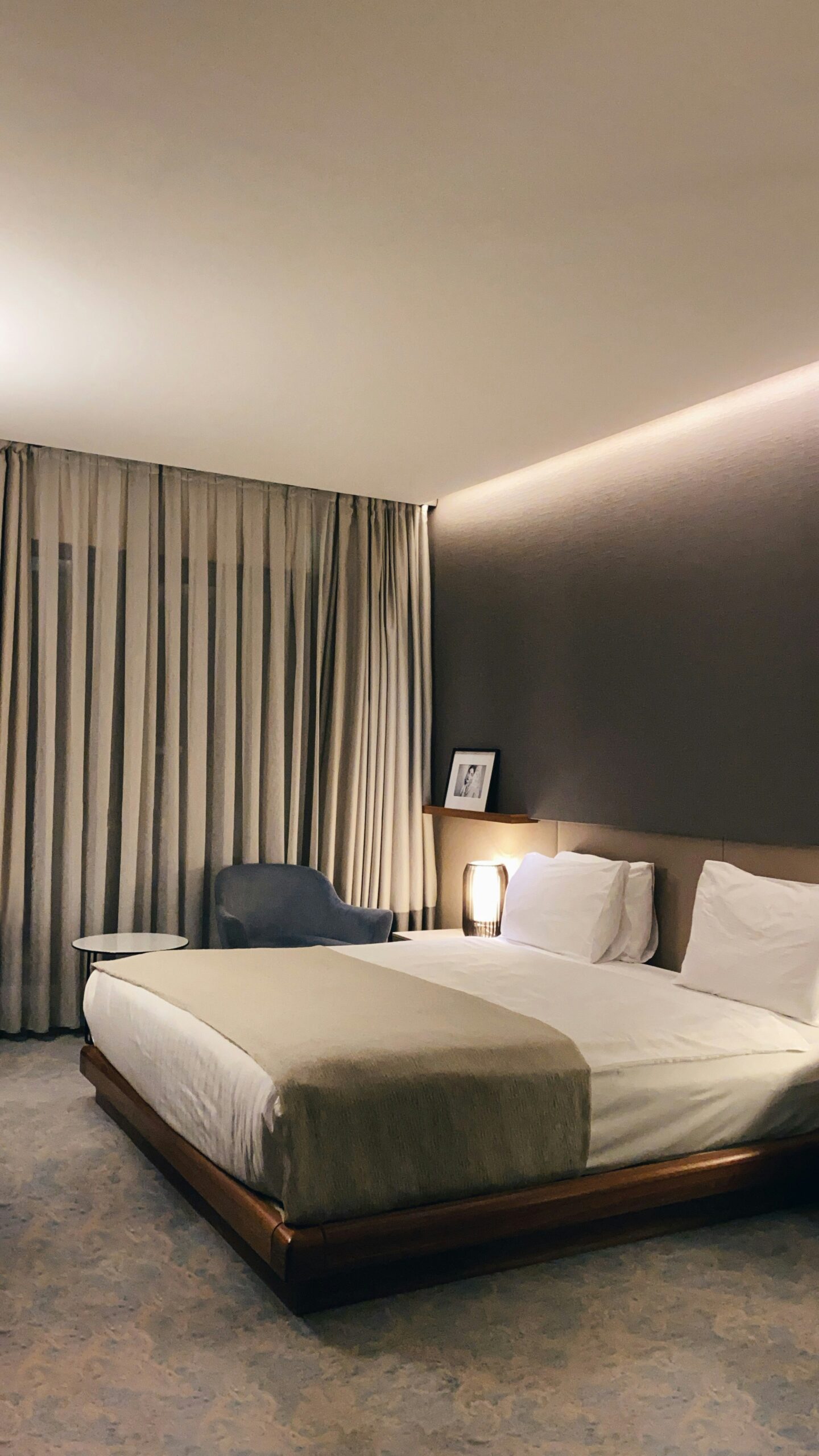 A calm modern hotel room prepared for a guest stay